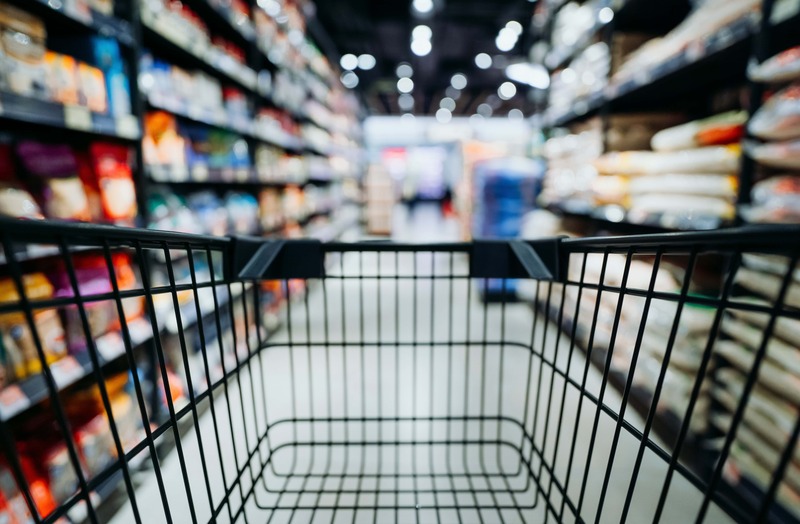 Image: A shopping cart in a warehouse aisle
